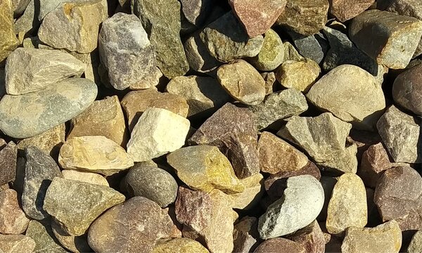 Abstract background with lot of various shape peeble stones. 
