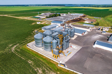 aerial view on agro silos granary elevator with seeds cleaning line on agro-processing...