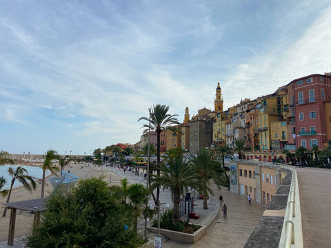 Menton, France, October 2, 2021: The Basilica of Saint-Michael the Archangel and Sablettes beach, located between the two ports (the Old Port and Garavan), along the Quai Bonaparte and the old town.
