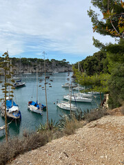 Fototapeta na wymiar Cassis, France, October 5, 2021: The Calanque of Port Miou near Cassis, with the boats moored along the banks. The Calanque de Port Miou (