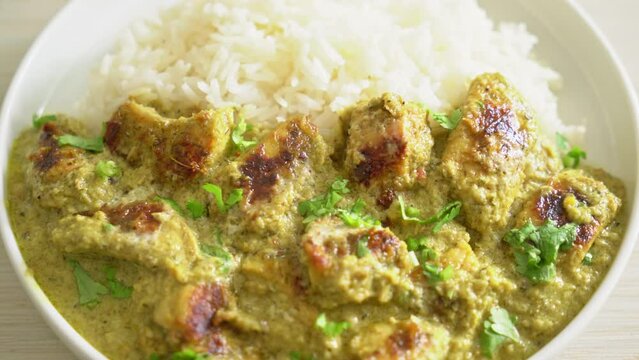 Afghani chicken in green curry or Hariyali tikka chicken hara masala with rice - Asian food style
