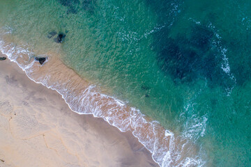 aerial view of a empty beach in the north of Portugal with turquoise waters.