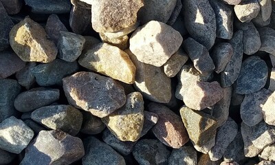Abstract background with lot of various shape peeble stones. 