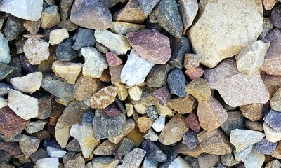 Abstract background with lot of various shape peeble stones. 