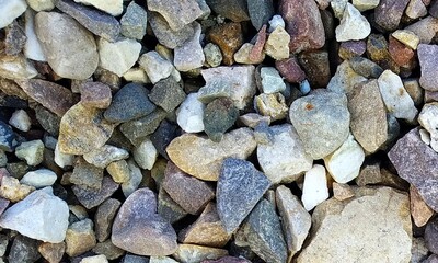 Abstract background with lot of various shape peeble stones. 