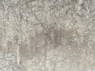 Wall fragment with scratches and cracks.vintage dirty exfoliating plaster Textured background peeling of colour wallpaper cement.The​ pattern​ of​ surface​ wall​ concrete​ for​ background.