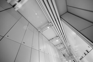 Fototapeta premium Pipes on ceiling in corridor