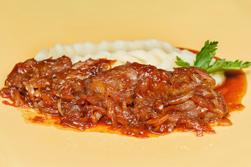 Pork in sweet sauce in Chinese with mashed potatoes