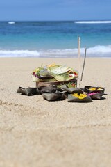 offering to the gods in Bali on the sea beach