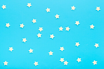 modern trendy pattern of sprinkles for design banner, poster, flyer, card, postcard, cover, brochure over blue background, top view