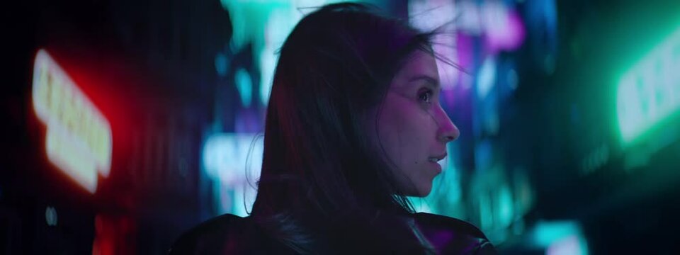 CU Night portrait of Hispanic standing in the streets filled with neon lights. Hong Kong style background