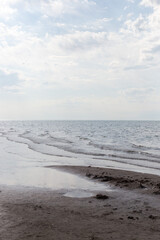 Sandy beach with blue sea and blue sky and white cloud is beautiful on the coast. beautiful blue ocean shore outdoor nature landscape water background.