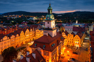 Naklejka premium Beautiful architecture of the Town Hall Square in Jelenia Gora at dusk, Poland