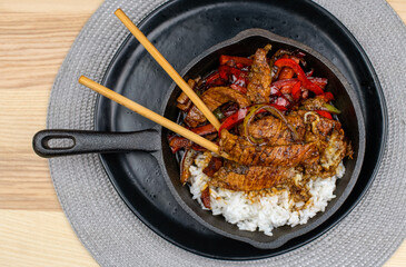 Crispy beef with ginger and vegetables in sweet sauce
