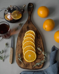 The orange is cut into round slices on a board