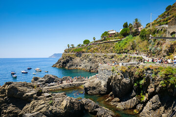 Travel to Cinque Terre (English Five Lands). Aerial view over Manarola architecture landmark village at the coast of Liguria Sea from Italy. 