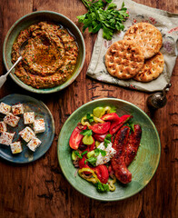 Grilled sausage and tomato salad