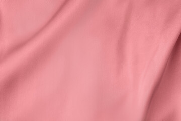 Creased coral light pink color smooth satin silk cloth texture decorate background with...