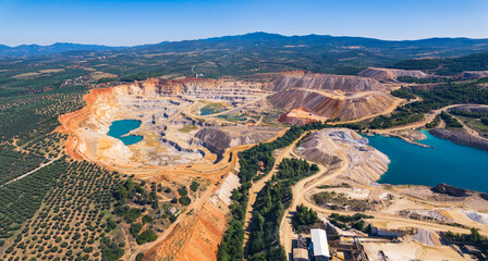 Open-pit mining concept. Drone aerial view of an open-pit mine in Greece. Human and environment concept. High quality photo