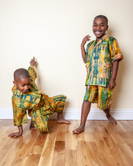 Traditional Ghanaian Fashion. Bright Kente fabrics from Ghana, West Africa, being modelled by...