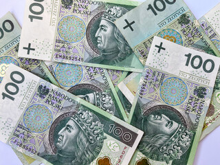 Fototapeta na wymiar Background of one hundred zloty notes. The texture of one hundred zloty notes. Currency of Poland
