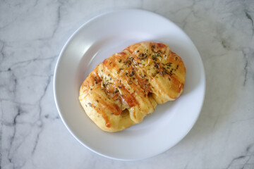 Sausage buns bread. Soft baked bun (dough) stuffed with sausage for fast food breakfast or coffee break. Sausage roll, (hot dog).
With mayo, tomato sauce, mozarella cheese and parsley topping

