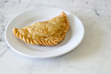 Cornish pasty filled with chicken and potato. Pastry minced pie or Pastel asian style cuisine. Homemade flaky pasty with mince meat filling - obrazy, fototapety, plakaty