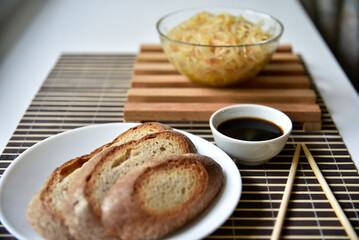 Korean rice noodles with meat and spices. Noodles with sauce and bread. Noodle sticks.