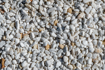 Light rounded stones. Light textured background image.