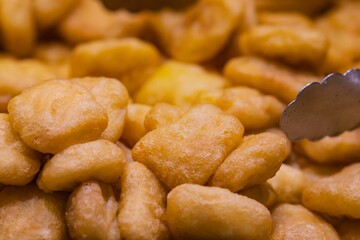 Breaded fried fish in a market in Seville (Spain), Spanish gastronomy concept.