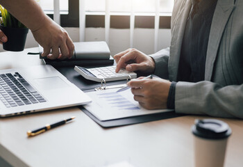 Financial advisors work with business people. Calculation and analysis of financial statement accounting data on the desk.