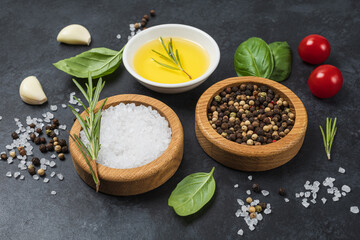 Food background from vegetable, spices, herb on black table.