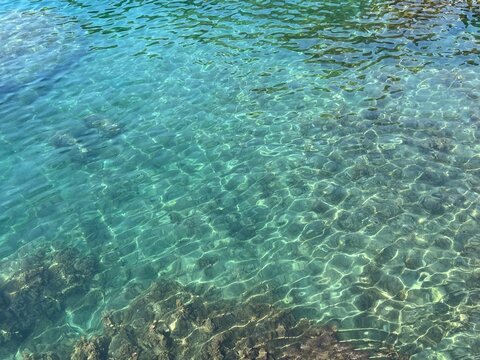 Sea clear shiny water background. Amazing seascape in paradise lagoon.