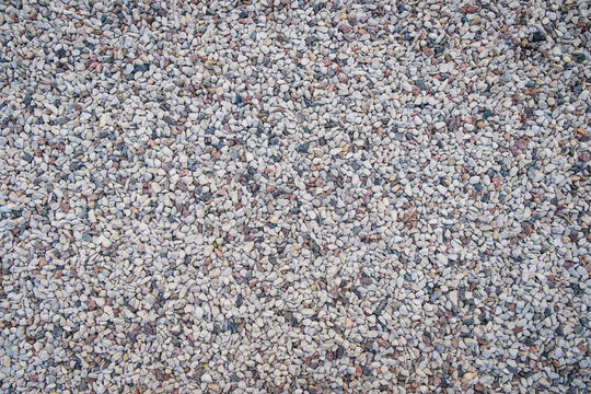 Mixed Small Gray Broken Rocks, Loose Gravel, Road Construction. Limestone Aggregate. Crushed Stone Background