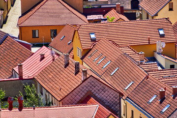 Aerial view of roofs of houses standing close together in medieval European village