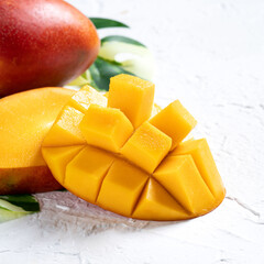 Mango background design concept. Top view Diced fresh mango fruit on white table.