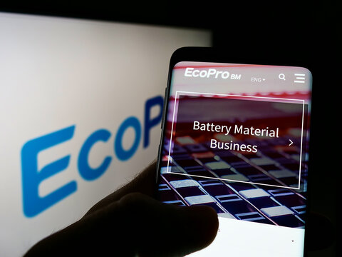 Stuttgart, Germany - 01-09-2022: Person holding smartphone with webpage of South Korean company Ecopro BM Co. Ltd. on screen in front of logo. Focus on center of phone display.