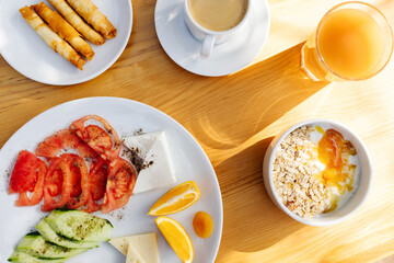 Traditional Turkish breakfast on wood table with morning sunlight