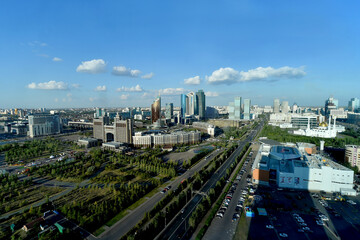 Fototapeta na wymiar Top view of cityscape of Astana, the capital of Kazakhstan, with modern skyscrapers,park and wide roads.