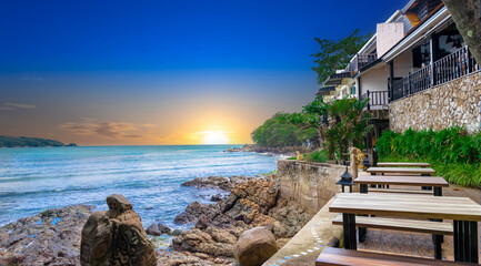 Colourful Skies Sunset over Kamala Beach Patong Pa Tong Beach in Phuket island Thailand. Lovely turquoise blue waters, lush green mountains colourful skies