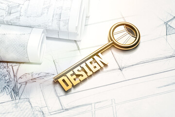 The key with the inscription DESIGN lies on the drawings with the layout of the interior of a residential apartment.