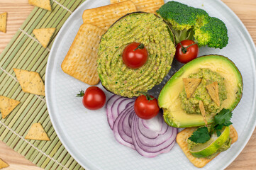 Broccoli Guacamole dip. Broccomole sauce. Stuffed avocado