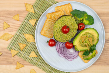 Broccoli Guacamole dip. Broccomole sauce. Stuffed avocado