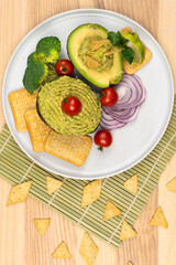 Broccoli Guacamole dip. Broccomole sauce. Stuffed avocado