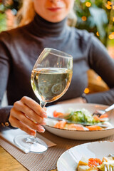 dinner in the restaurant, woman with wine