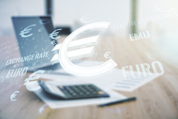 Virtual EURO symbols illustration on blurry calculator and computer background, forex and currency concept. Multiexposure