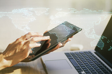 Multi exposure of abstract graphic world map and hand working with a digital tablet on background, connection and communication concept