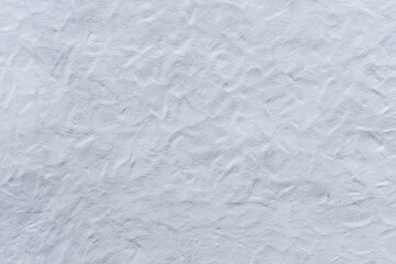 corrugated plaster from a white wall of a castle
