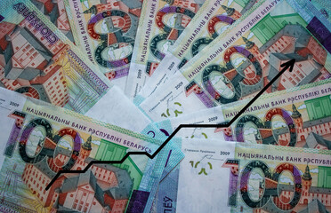 A background of one hundred Belarusian rubles with a growth schedule . A hundred-ruble bill of the Republic of Belarus. National currency