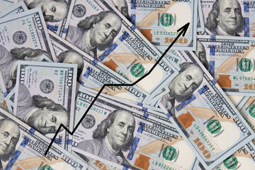 Background of hundred-dollar banknotes with a growth chart. The texture of hundred-dollar bills. A lot of dollars